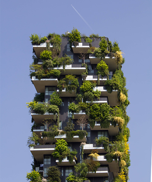 A multi-story building with trees and greenery growing on the exterior. benefits of urban gardens